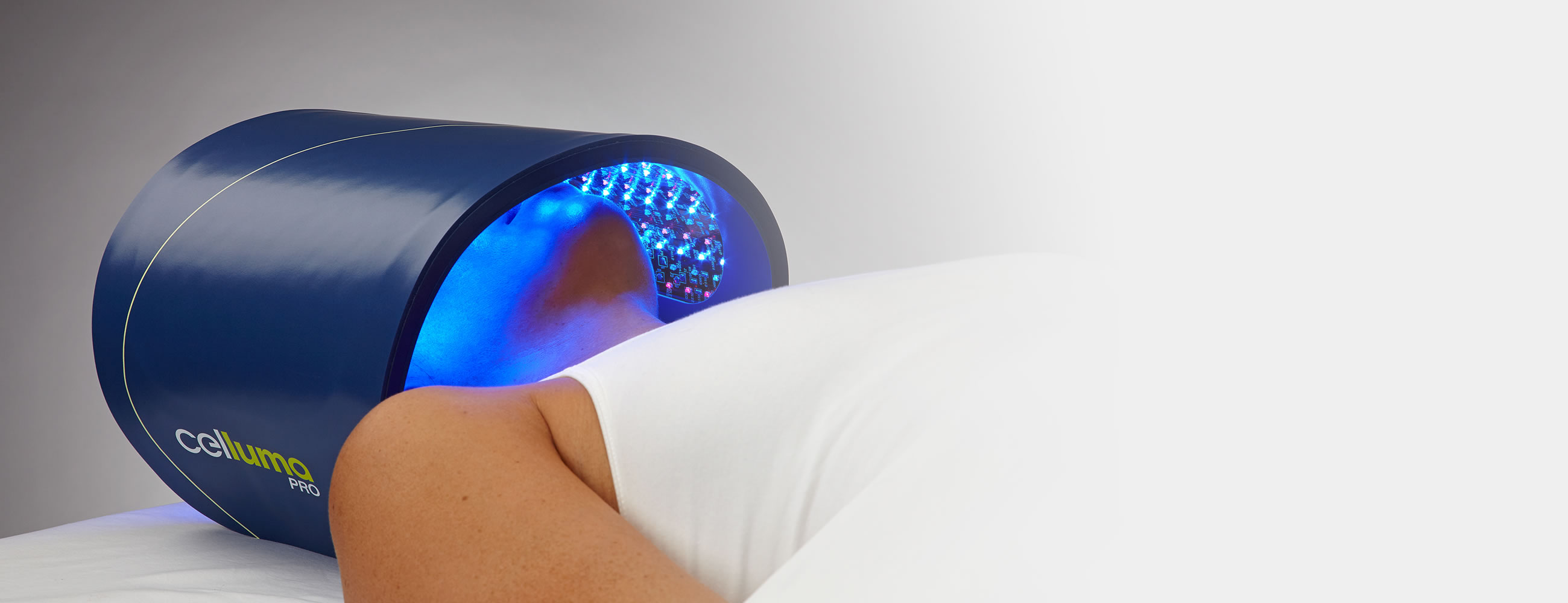 Celluma Pro LED light therapy device positioned over a client's face during a session at Innovation Wellness in Early, Texas