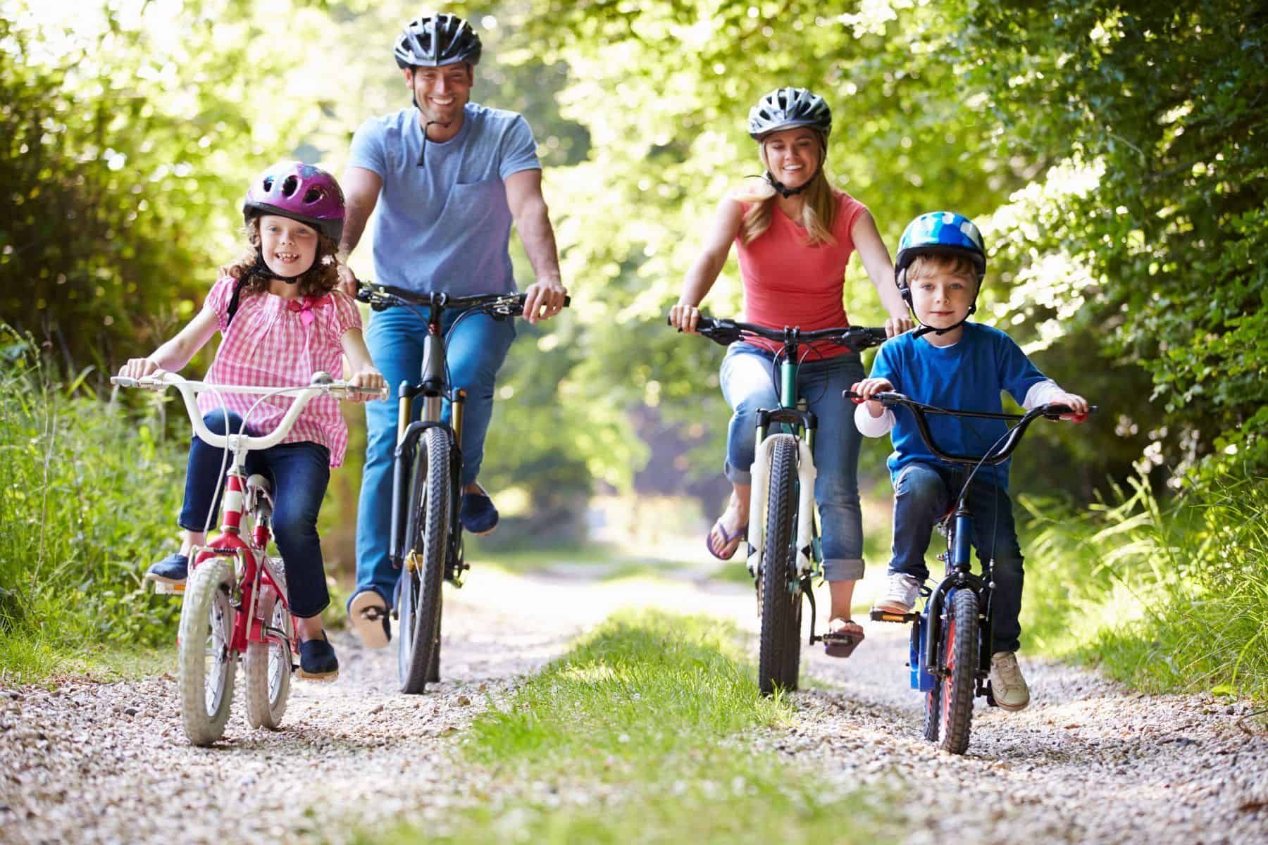 Family cycling together outdoors — active recovery and wellness lifestyle supported by Innovation Wellness in Early, Texas